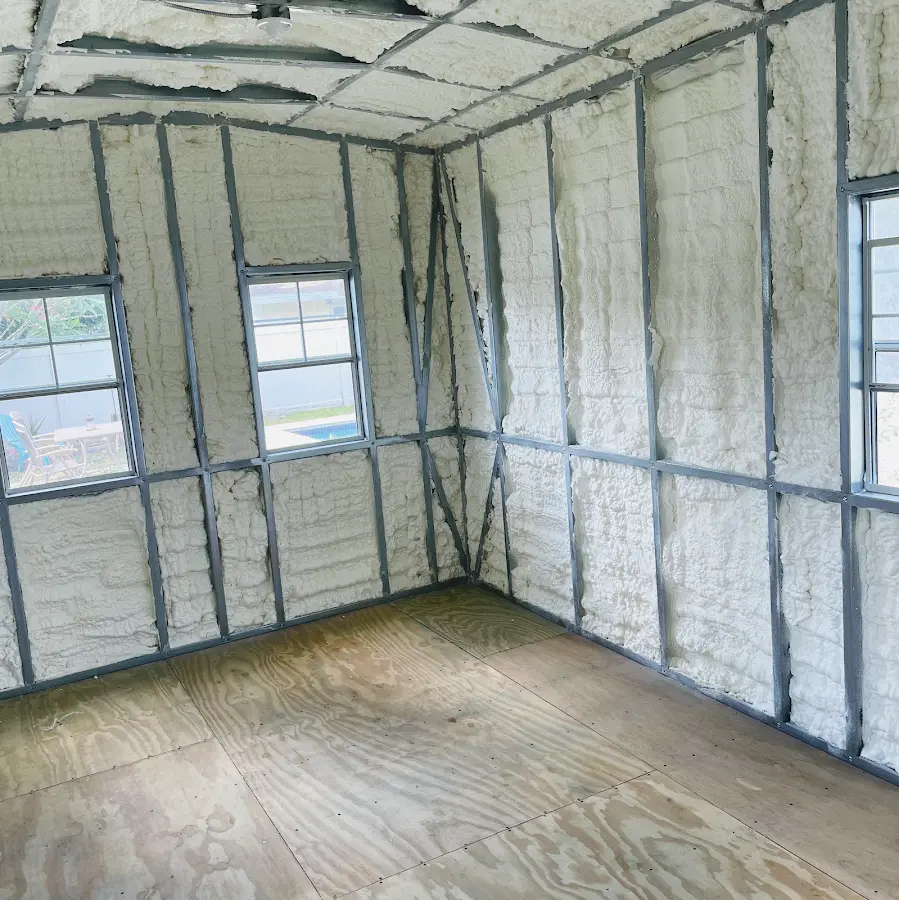 Closed-cell spray foam insulation applied to wall cavities in a residential project in Marcellus
